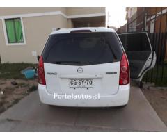 por traslado vendo auto mazda premacy año 2004
